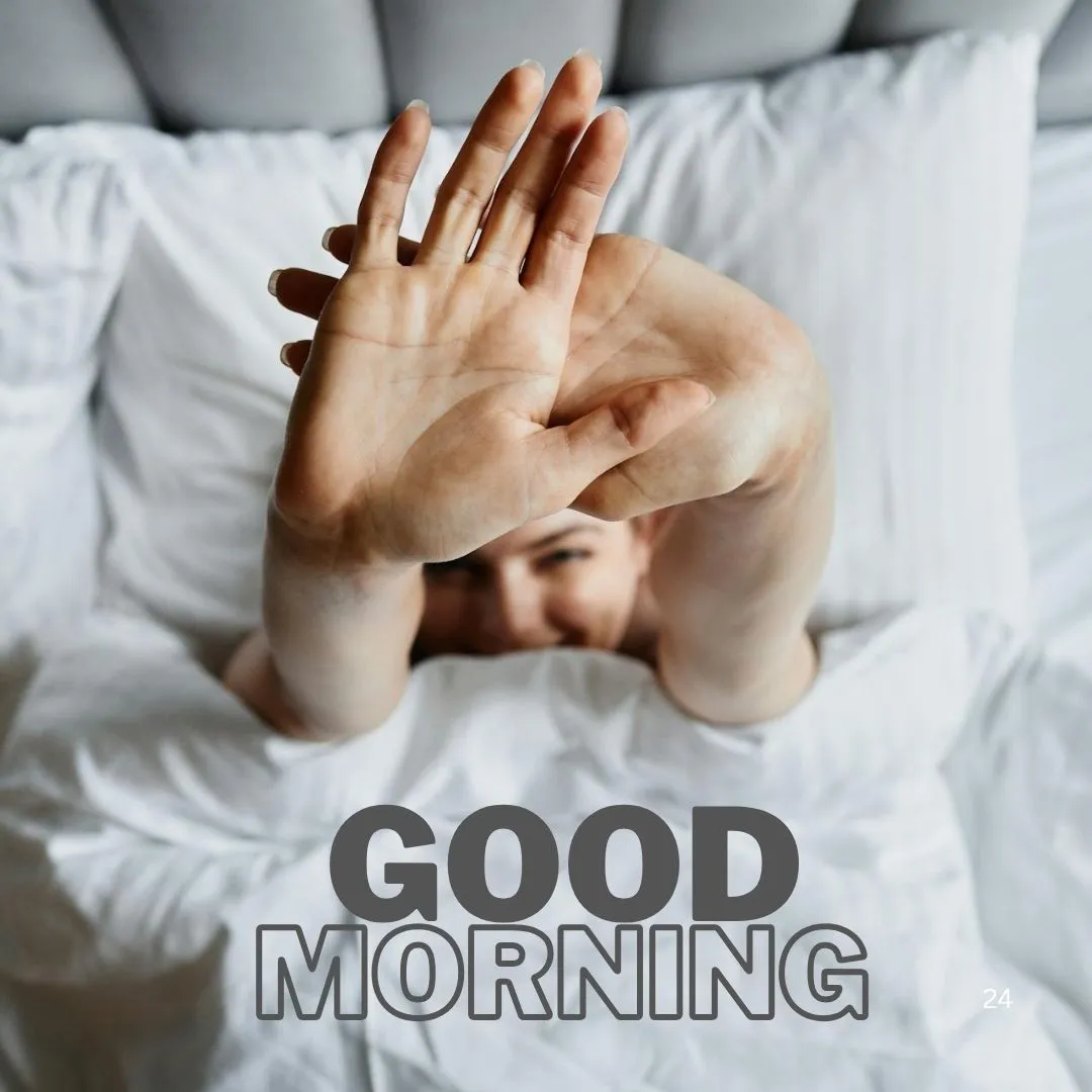Stretch and Shine – Fresh Good Morning Image with Woman in Bed Woman stretching hands while lying in bed under white blanket with “GOOD MORNING” text image