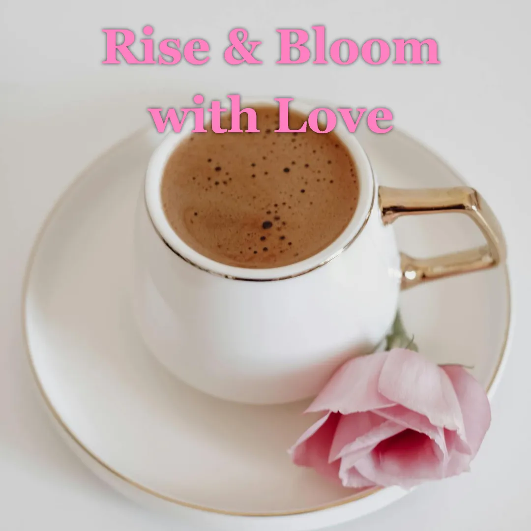 White coffee cup with a golden handle and pink rose on saucer, representing a peaceful good morning with love.